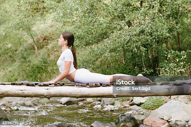 Woman Doing Yoga In Nature Stock Photo - Download Image Now - Adult, Adults Only, Balance