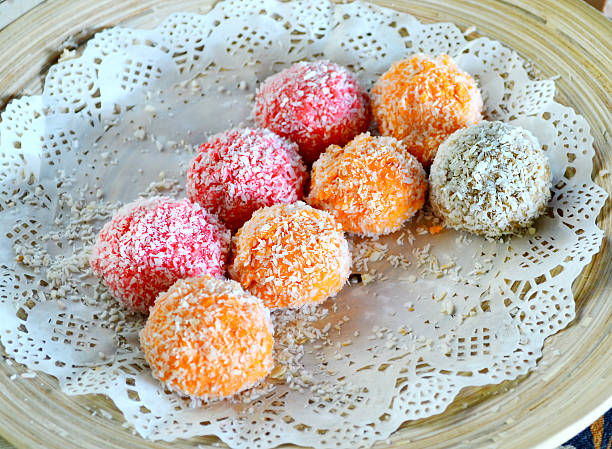 istock Orange, white and pink coconut candies 517363673