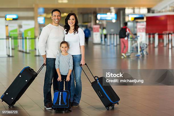 Family With Suitcases At Airport Stock Photo - Download Image Now - Adult, Airplane, Airplane Ticket