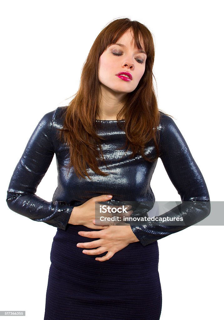 Girl in Shiny Dress Feeling Sick woman canceling plans to go out and feeling sick Abdomen Stock Photo