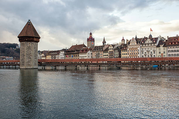 istock Kapellbrucke chapel bridge with water tower in Lucerne, Switzerland 517370320