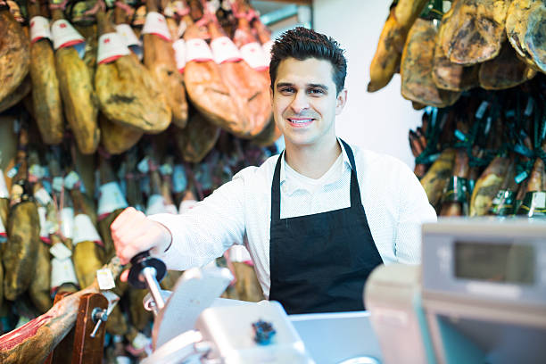 istock Seller in delicatessen section 517370350