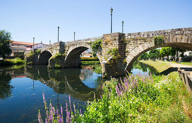 istock river and old stone bridge at Monforte de Lemos 517370694