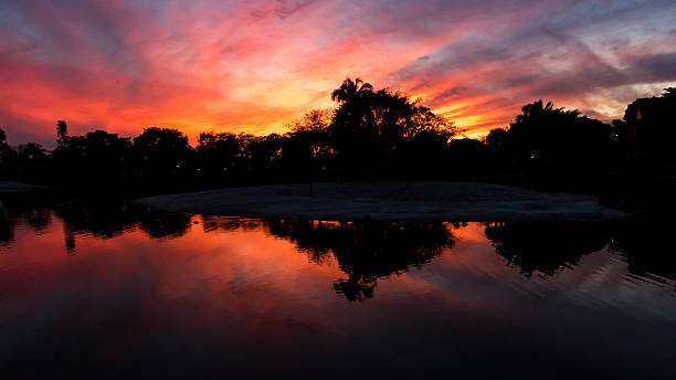 Sunset, Lake at The Hammocks, Kendall, Florida Sunset, Lake at The Hammocks, Kendall, Florida kendall stock pictures, royalty-free photos & images