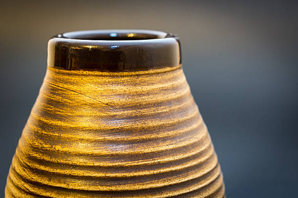 Part of yerba mate gourd alone on the black background.