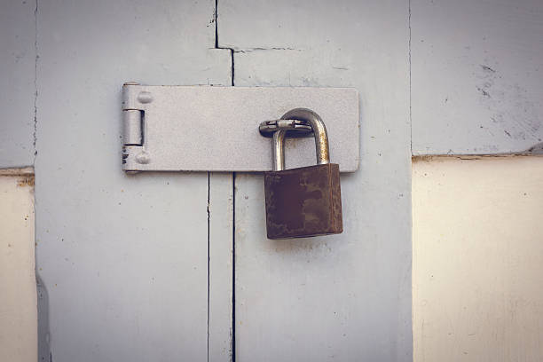 istock Closeup wooden door with lock 517374886