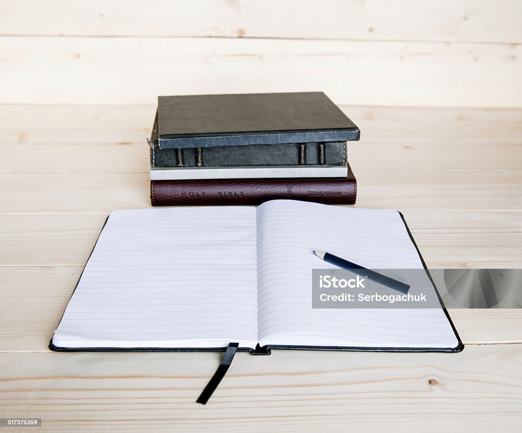 Opened notepad, fountain pen and books Abstract Stock Photo