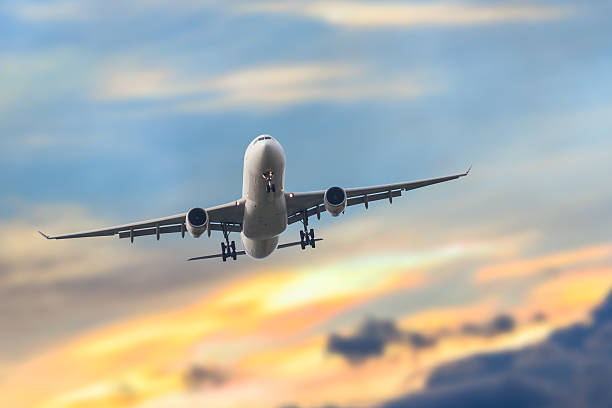 istock Passenger business airplane take off and flying in sky sunset 517376858
