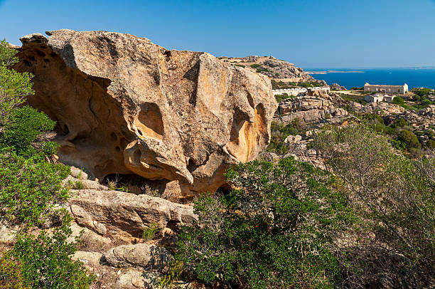 istock Weathered rocks of Sardinia and abandoned barracks 517377557