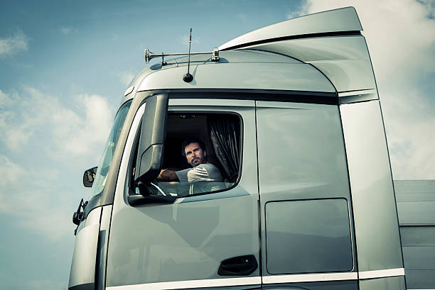 istock Truck Driver Sitting In Cab 517378201