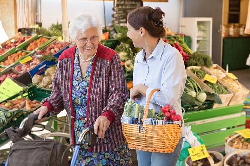 Assisted living - senior woman with caregiver shopping