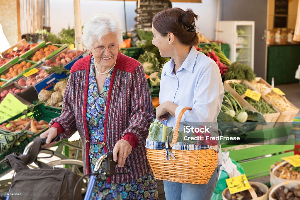 Assisted living - senior woman with caregiver shopping Senior Adult Stock Photo