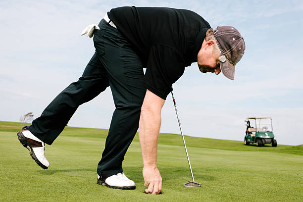 istock Repairing a pitch mark 517380029