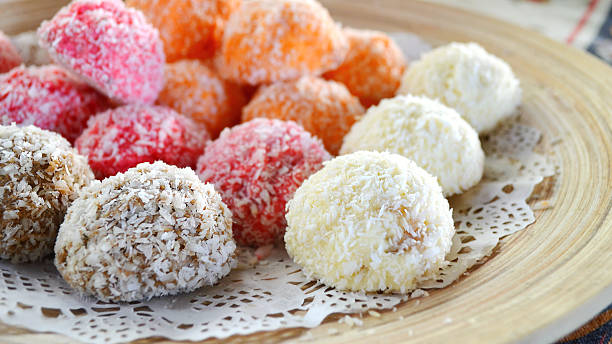 istock Orange, white and pink coconut candies 517380565