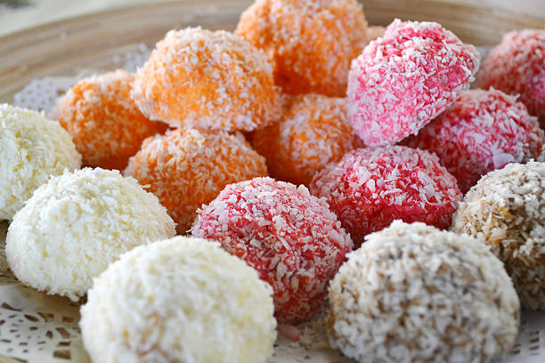 istock Orange, white and pink coconut candies 517380567