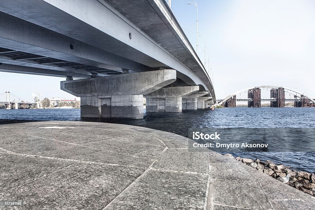 Embankment near bridge Embankment near bridge near Dnieper river, Kyiv, Ukraine Architecture Stock Photo