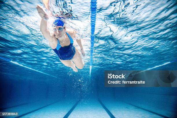 Woman Swimming Freestyle Stock Photo - Download Image Now - Swimming, International Multi-Sport Event, Swimming Pool