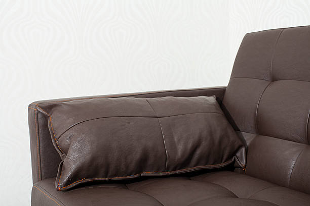 istock Classic brown leather sofa with pillow in room 517382506