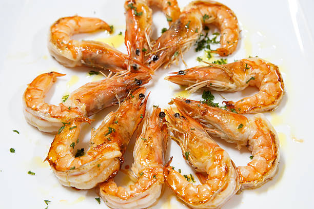 istock delicious cooked prawn plate served with olive oil 517383562