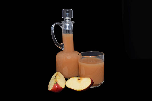 istock The Apple juice in a pitcher with Apple on a black background 517395911