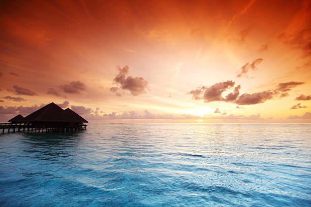 istock maldivian houses on sunrise 517396649