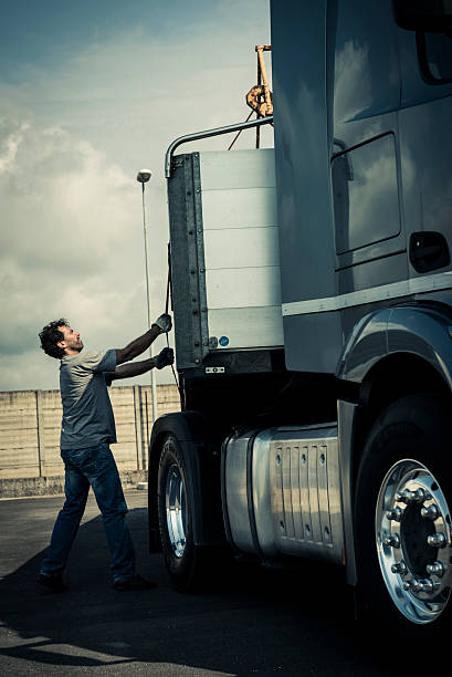 istock Truck Driver Working On Truck 517397355
