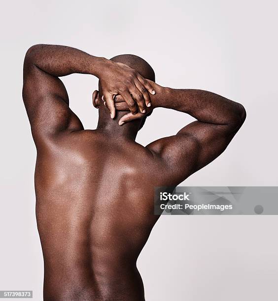 Stretching Out Those Back Muscles Stock Photo - Download Image Now - Men, Rear View, Stretching