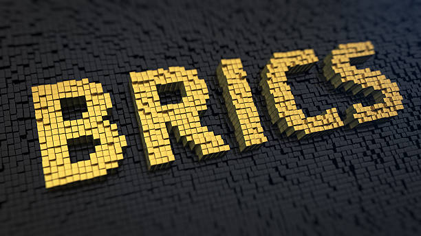 BRICS cubics Acronym 'BRICS' of the yellow square pixels on a black matrix background. International ecenomy concept. brics stock pictures, royalty-free photos & images