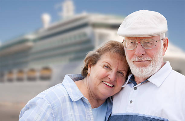 istock Senior Couple On Shore in Front of Cruise Ship 517400049