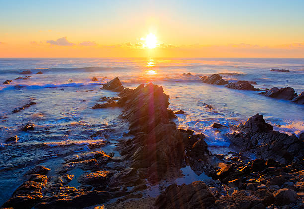 istock Beautiful sunrise over cretaceous sedimentary rock coastline 517400879