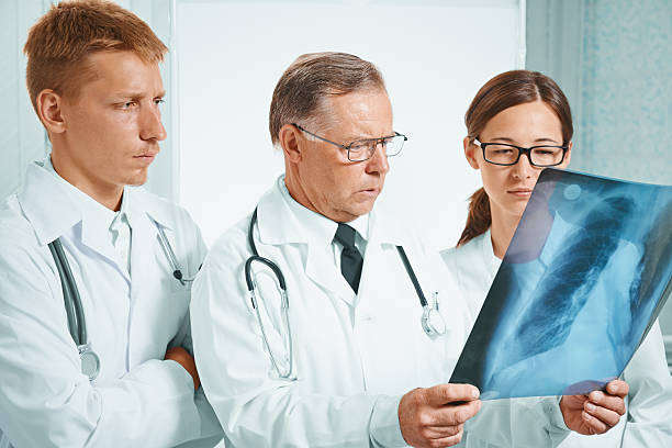 istock Physicians examine x-ray image of lungs 517400987