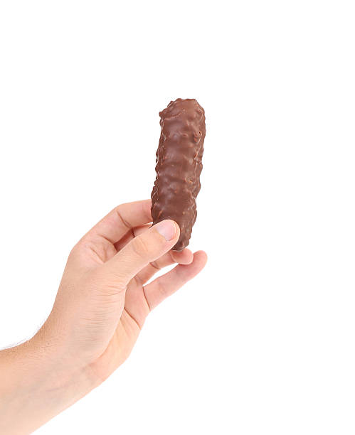 istock Hand holding tasty chocolate bar. 517402111