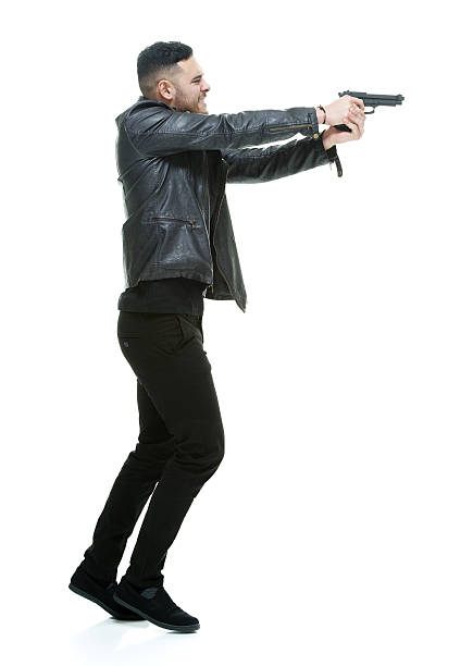 istock Casual angry man aiming with handgun 517408188