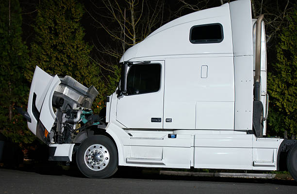 istock Semi truck with open hood and engine repairs 517409162