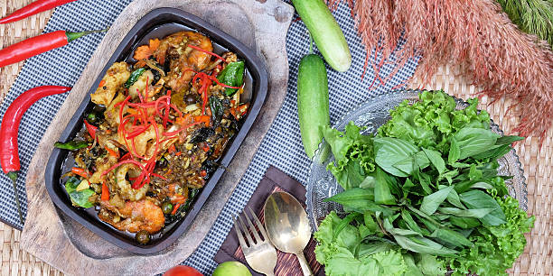 istock Curry Steamed Seafood in Coconut Cup 517410728