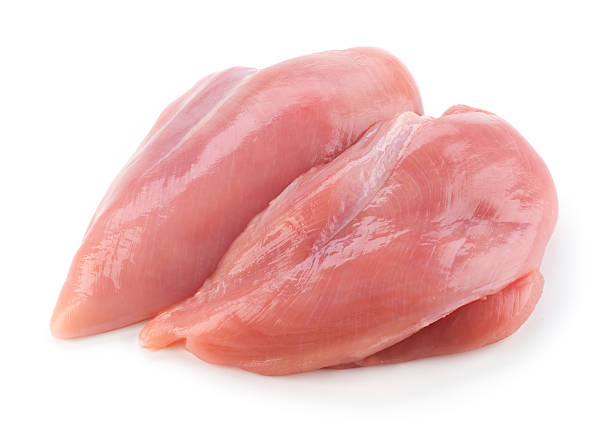 istock Raw chicken fillets close up on white 517411584