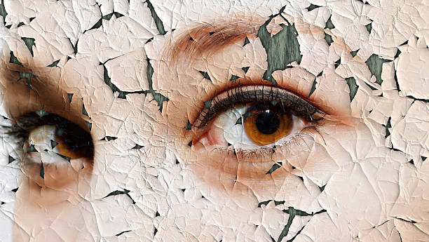 Young woman with cracked face Beauty and health concept - face covered with cracked surface - symbol of dry skin and stress dermatitis photos stock pictures, royalty-free photos & images