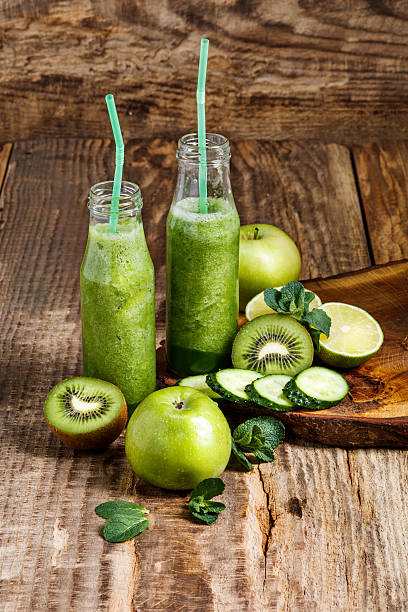 istock The bottles with fresh vegetable juices on wooden table 517413698