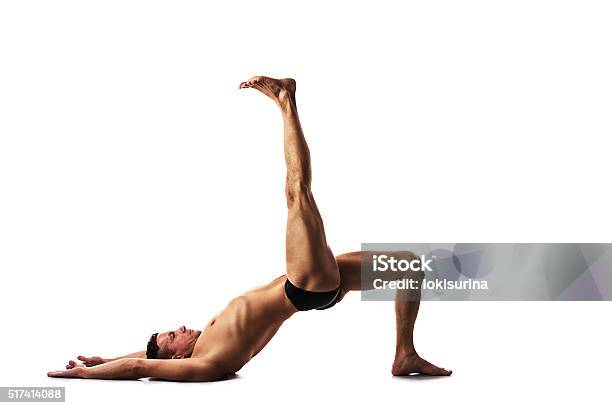 Strong Male Doing Yoga And Fitness Yoga Exercises Posture Iron Bridge Stock  Photo - Download Image Now - iStock