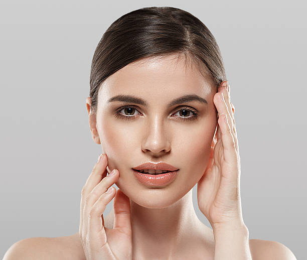 istock Beautiful woman portrait face studio isolated on gray background 517414314