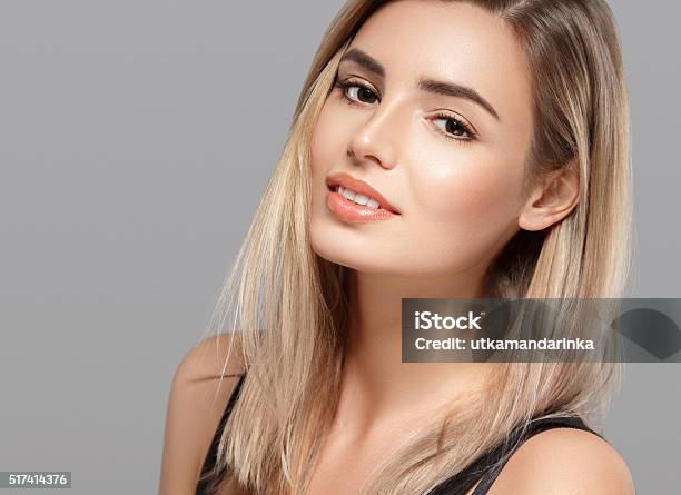 Beautiful Young Woman Smiling Posing On Gray Background Stock Photo - Download Image Now