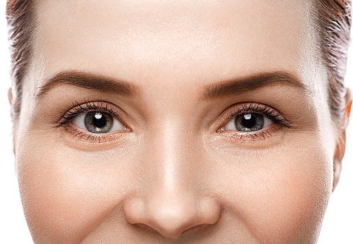 Eye woman eyebrow eyes lashes. Studio shot.