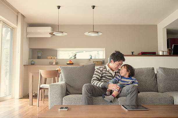 istock Fatherr and son having fun time at home 517416096