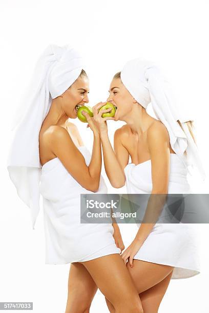 Two Happy Teen Girl After Shower Playing With Apple Stock Photo - Download Image Now