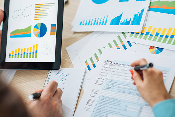 istock Teamwork with two business people in office with business analysis 517417106