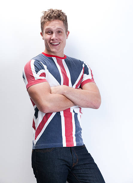 istock British man standing with arms crossed 517417610