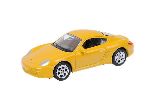 Porsche Cayman S Welly Diecast Toy Car Adelaide, Australia - March 25, 2016:An isolated shot of a Porsche Cayman S Welly Diecast Toy Car. Replica diecast toy cars are highly sought after collectables. toy car stock pictures, royalty-free photos & images