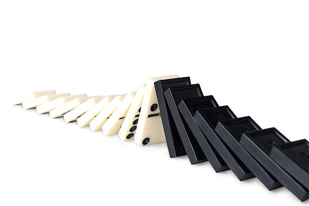 istock Meeting of falling dominoes 517420570
