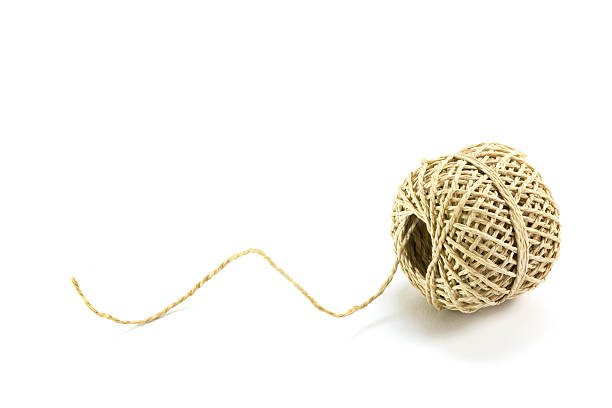 istock Ball of string  isolated with shadows on a white background 517421660