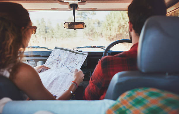 istock Couple driving on country road 517422034